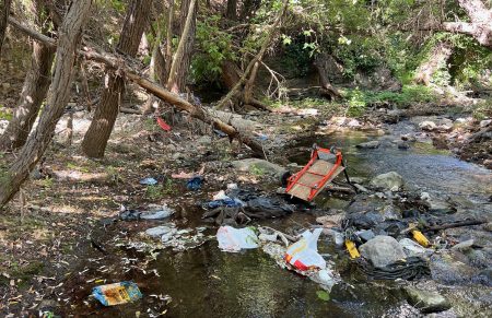 Dirty trashed Arroyo Conejo creek