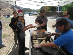 Serving up tacos for the volunteers as thank-you for their hard work in preparing the trails for upciming winter rains